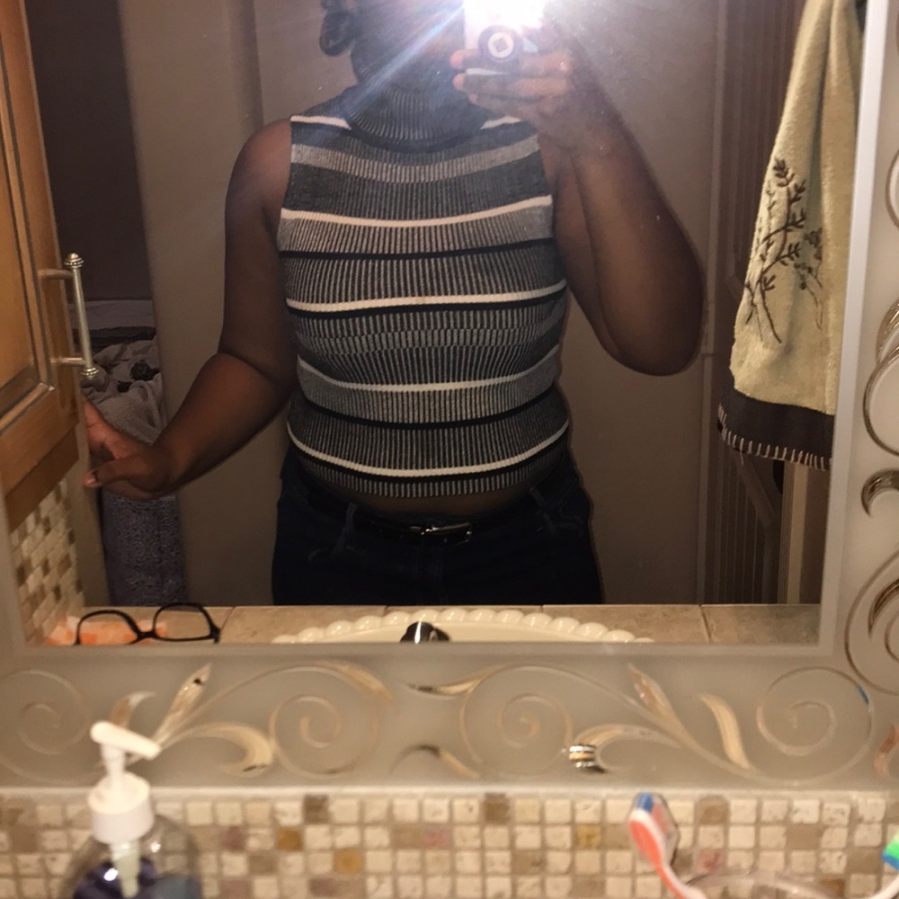 Black and white sleeveless turtleneck